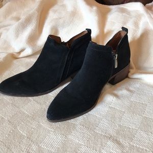 A pair of Franco Sarto bootie black leather suede